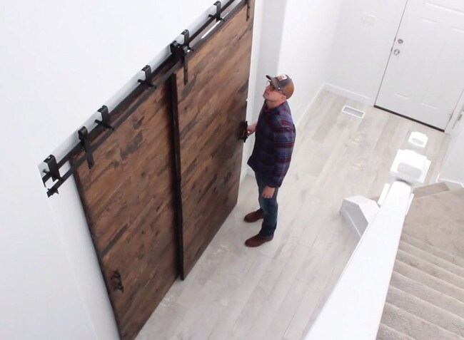 Sliding Barn Door Hardware Kits for By-Passing Wood Doors Up to 34in W | Black Powder Coated Finish | 68-7/8in Rail Length